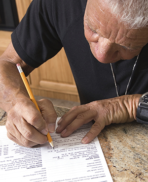 Man filling out form