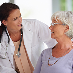 Woman talking to doctor