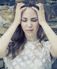 Young woman with hands in hair